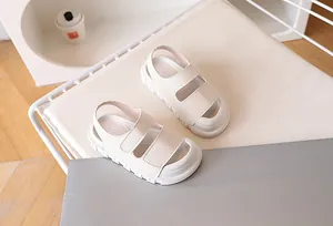 Detailed side view of off-white kids sandals featuring chunky soft sole and non-slip texture