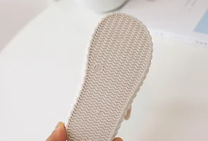 Detail of non-slip rubber sole with wave pattern and size 24 for kids canvas shoes