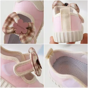 Pink girls canvas shoes with brown plaid bow and floral fashion detail
