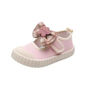 Pink Mary Jane canvas shoes for girls featuring a plaid bow and flower buckle detail