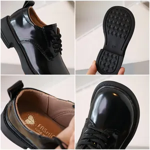 Black glossy patent leather kids' derby shoes with lace-up design and non-slip rubber sole