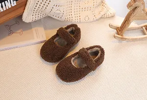 Detailed macro shot of brown faux shearling toddler Mary Janes with velcro strap closure