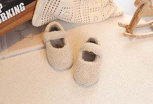 Detail of plush beige Mary Jane shoes for girls featuring soft faux shearling texture