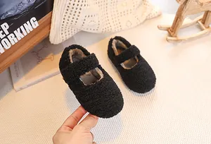 Detail of plush black Sherpa Mary Jane baby shoes with soft velcro strap for winter