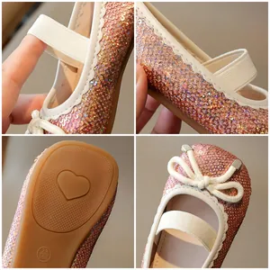 Pink sequin Mary Jane shoes for girls featuring a bow and non-slip heart pattern sole