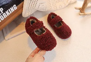 Detail of burgundy plush Mary Jane shoes for kids featuring soft sherpa texture