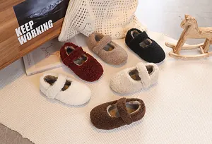 Flat lay of fluffy sherpa Mary Jane shoes for children in six warm autumn colors