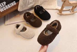 Detail of plush lamb wool Mary Jane shoes for kids in brown, black and beige colors