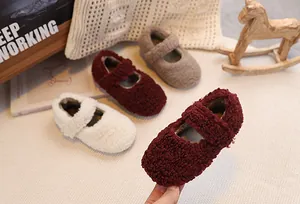Detailed close-up of plush baby Mary Jane shoes in beige, burgundy and khaki colors