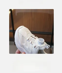 Detail view of white kids sneakers featuring breathable mesh and rotating knob buckle