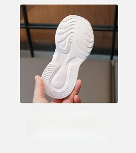 Detailed view of white anti-slip EVA sole with size 28 marking and wavy texture