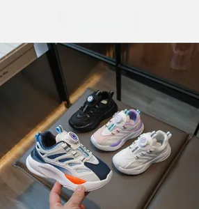 Detail of kids sneakers with quick-lace dial system and breathable mesh in multiple colors