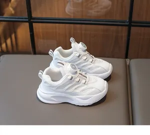 Detail view of children white sneakers featuring a convenient rotary dial lacing system