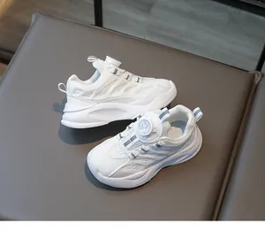 Detail of white kids sneakers featuring breathable mesh and rotating buckle closure