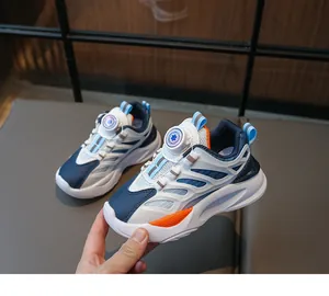 Detailed view of child sneakers with a rotary dial lacing system and mesh panels