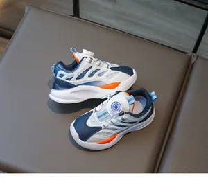 Detail of kids athletic shoes featuring a convenient rotary knob buckle lacing system