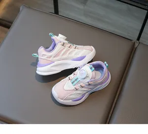 Detail view of pink and purple kids' sports shoes with easy-to-use rotary knob lacing