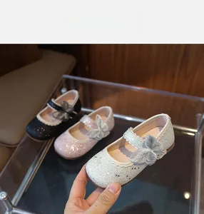 Detailed display of glitter Mary Jane shoes for girls in black, pink, and silver options