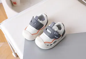 Macro view of toddler shoe featuring a cute dinosaur print and secure velcro strap closure