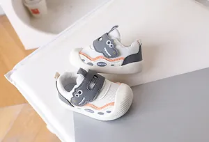 Detail view of baby walking shoes with breathable mesh and protective toe cap