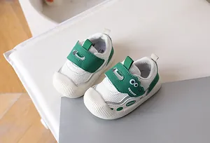 Close-up of baby dinosaur walking shoes with breathable mesh and protective toe caps