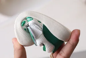 Macro shot showing the high flexibility of the soft sole on toddler walking shoes