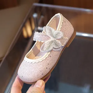 Pink glitter Mary Jane flats for girls featuring embroidered butterfly and white scalloped trim