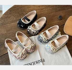 Detail view of sparkly sequin toddler princess flats in five colors with bow and rhinestone