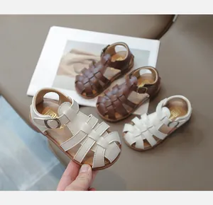 Close-up of woven children's Roman sandals with matte leather texture and adjustable buckles