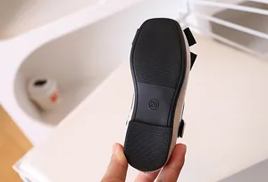 Macro detail of toddler Mary Jane shoes showing anti-slip rubber sole and size 26 marking