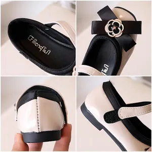 Girls cream leather Mary Jane shoes with black bow and camellia metal decoration