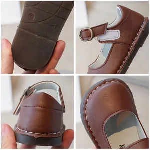 Brown leather Mary Jane kids' shoes with retro round toe and white stitching details