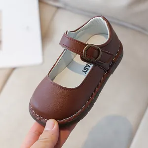 Classic dark brown children's Mary Jane leather shoes with vintage buckle and white stitching
