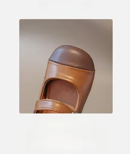 Macro shot of Mary Jane shoes featuring a round toe design and dual-tone brown matte finish