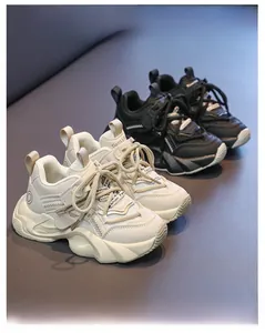 Detailed view of kids chunky sneakers featuring mesh leather patchwork and non-slip soles