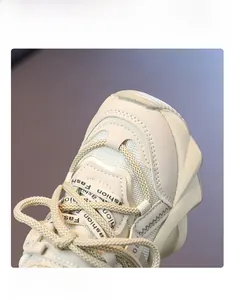 Detailed macro view of the cream chunky sneaker featuring mesh leather and Fashion strap