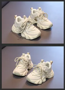 Detail view of children's thick-sole sneakers featuring leather mesh and woven strap accents