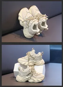Detailed close-up of kids cream chunky sneakers with mesh texture and side CA logo