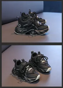 Detail of children's black sneakers featuring a thick non-slip sole and mesh leather mix