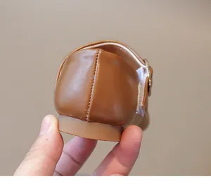 Close-up of brown children's Mary Jane shoes with soft leather and flexible rubber sole