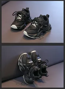 Close-up of black children sneakers featuring leather mesh stitching and thick sole