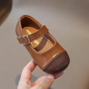 Toddler girls brown two-tone Mary Jane shoes with adjustable gold buckle and soft leather