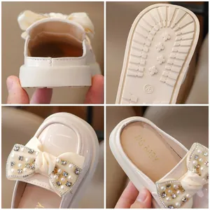 Kids cream leather mule loafers with lace bow and pearl rhinestone accents