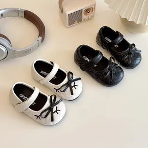 Elegant quilted Mary Jane princess shoes for girls with bow accents in black and white