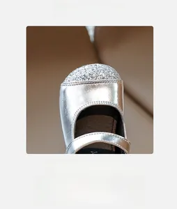 Macro detail of sparkly silver glitter on the spacious round toe of girl's Mary Jane shoes