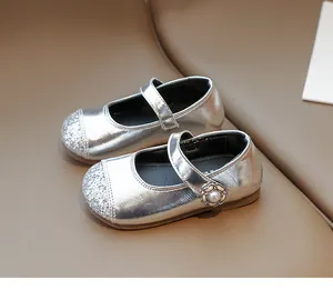 Detailed view of silver glitter Mary Jane shoes with pearl floral buckle for girls