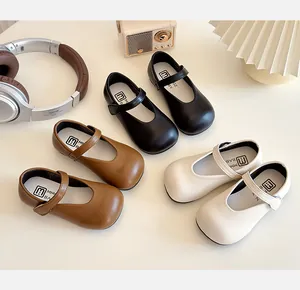 Three pairs of classic Mary Jane leather shoes for girls in black, brown, and beige colors