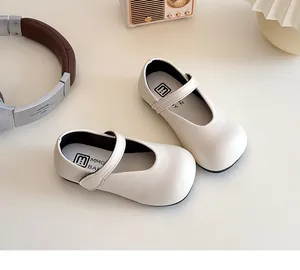 Top view of cream Mary Jane shoes with Velcro straps and comfortable padded insoles