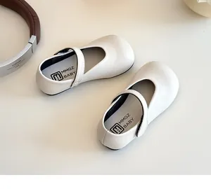 Detailed top view of cream Mary Jane shoes for girls with easy velcro strap