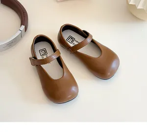 Top view of brown matte leather Mary Jane shoes for girls with convenient velcro strap